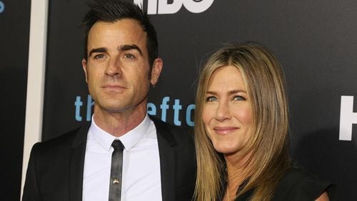 Justin Theroux and Jennifer Aniston arrive for the season two premiere of "The Leftovers" at the Paramount Theatre on Saturday, Oct. 3, 2015, in Austin, Texas.