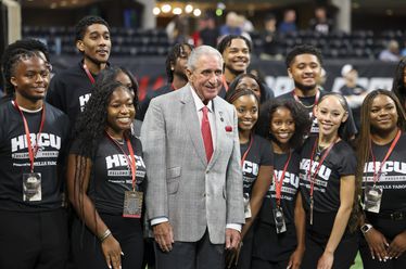 Atlanta Falcons owner Arthur Blank poses for a photograph with fans before the Falcons’ preseason NFL game against the Jacksonville Jaguars at Mercedes-Benz Stadium, on Friday, Aug. 23, 2024, in Atlanta. (Jason Getz / AJC)
