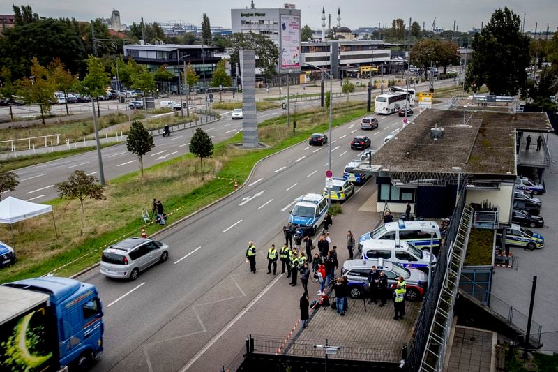 German police officers stand at the border between Germany and France in Kehl, Germany, Monday, Sept. 16, 2024, as Germany begins carrying out checks at all its land borders. (AP Photo/Michael Probst)