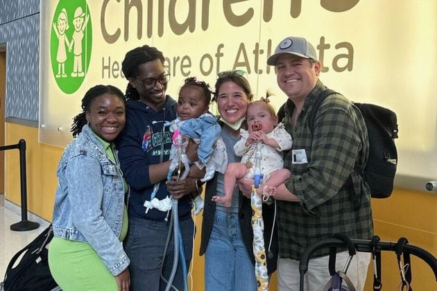 (From left) Love, Teddy and Royal Dacius and Torri, Wynnie and Alex Deason during Royal’s discharge from Scottish Rite Hospital in Sandy Springs. (Courtesy of Children's Healthcare of Atlanta)