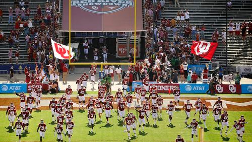 The Oklahoma Sooners football team takes the field to face the Texas Longhorns in the Red River Rivalry at the Cotton Bowl in Dallas on Saturday, Oct. 10, 2020. Oklahoma won in quadruple overtime, 53-45. (Tom Fox/Dallas Morning News/TNS)