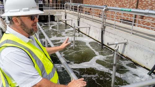 Fulton County Director of Public Works David Clark speaks about an aerated water tank. Fulton County officials tour the new water reclamation facility built on the grouds of the existing Big Creek Wastewater Treament center. Thursday, August 22, 2024 (Ben Hendren for the Atlanta Journal-Constitution)