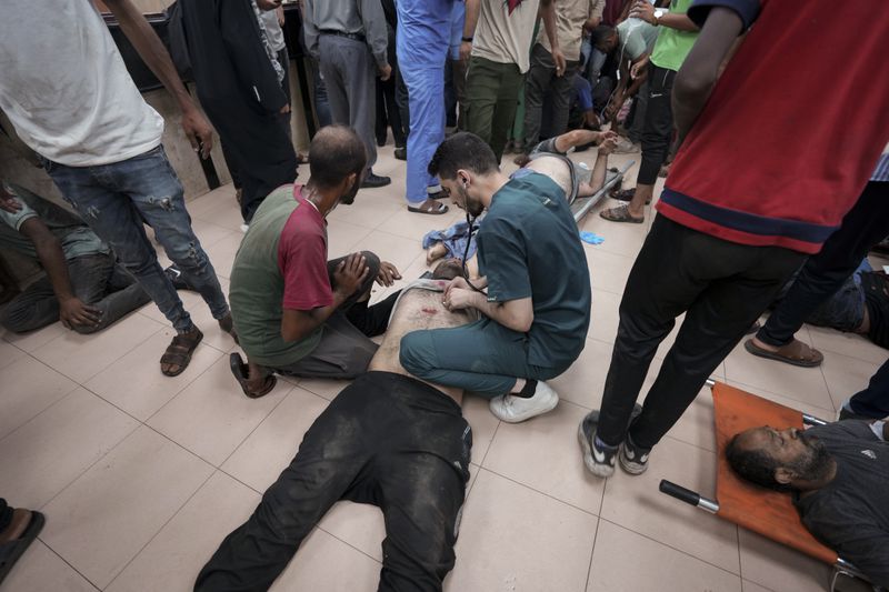 Palestinians wounded in the Israeli bombardment of the Gaza Strip are treated in a hospital in Deir al Balah on Tuesday, June 4, 2024. (AP Photo/Abdel Kareem Hana)