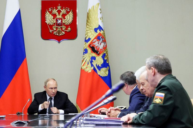 Russian President Vladimir Putin, left, leads a meeting with top security and defense officials about the situation in Kursk and Belgorod border regions, at Novo-Ogaryovo state residence outside of Moscow, Russia, Monday, Aug. 12, 2024. (Gavriil Grigorov, Sputnik, Kremlin Pool Photo via AP)