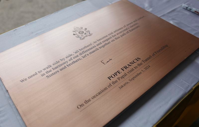 This shows a plaque signed by Pope Francis during his visit to the tunnel of friendship that connects the Istiqlal Mosque and the Catholic Cathedral of Our Lady of the Assumption in Jakarta Thursday, Sept. 5, 2024. (Mast Irham/Pool Photo via AP)