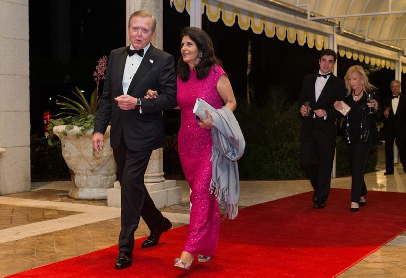 Lou Dobbs and his wife Debi Lee Segura walk the red carpet to the ballroom  for the Mar-a-Lago New Year's Eva Gala at Mar-a-Lago in Palm Beach, Sun., December 31, 2017  in Palm Beach, Fla. (Greg Lovett / The Palm Beach Post)