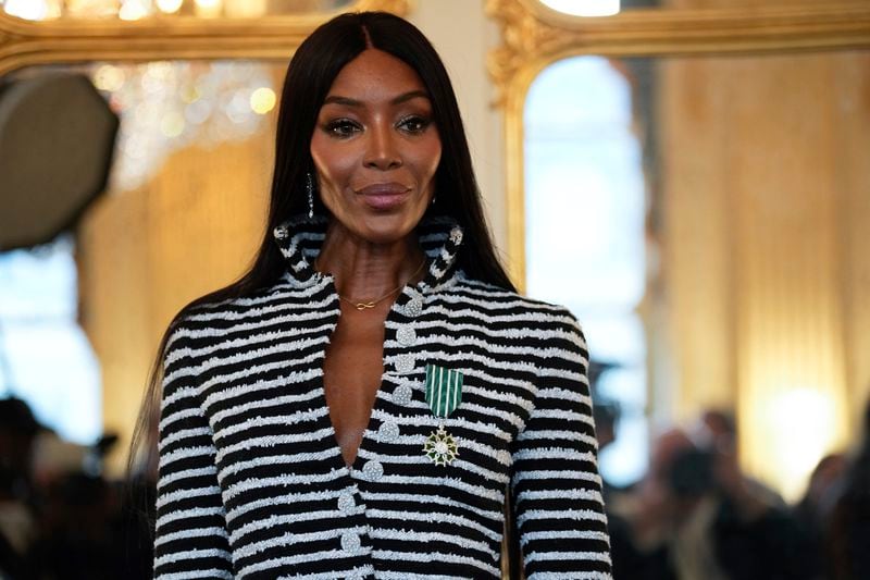 Naomi Campbell poses with the medal of "Chevalier de l'Ordres des Arts et des Lettres", after being awarded by French Culture Minister Rachida Dati, at the Culture ministry, in Paris, Thursday, Sept. 26, 2024. (AP Photo/Louise Delmotte)