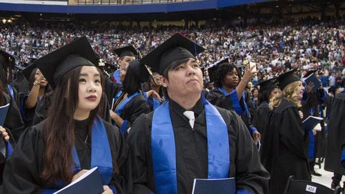 Georgia State University undergraduate students take part in the 2018 commencement ceremony at Georgia State Stadium in Atlanta on May 10, 2018. Georgia State has the largest enrollment of any school in the state. REANN HUBER / REANN.HUBER@AJC.COM