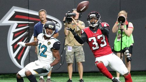 Falcons cornerback Blidi Wreh-Wilson intercepts the ball in front of Jaguars wide receiver Dede Westbrook in the end zone during the first quarter in a NFL preseason football game on Thursday, Aug. 31, 2017, in Atlanta.