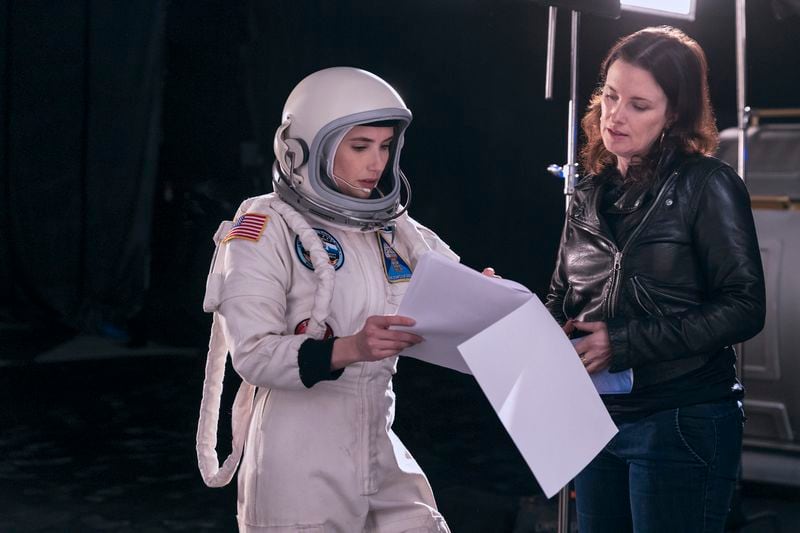 This image released by Amazon shows Emma Roberts, left, with director Liz W. Garcia on the set of "Space Cadet." (Eric Liebowitz/Prime Video via AP)