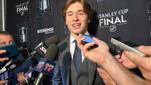 FILE - Macklin Celebrini, the expected No. 1 pick in the NHL draft to the San Jose Sharks, speaks with reporters prior to Game 2 of the Stanley Cup Final at Amerant Bank Arena in Sunrise, Florida, Monday, June 10, 2024. Celebrini sets aside his NBA ties by looking ahead to a hockey career, entering the NHL draft as the presumptive No. 1 pick on Friday, June 28. (AP Photo/Stephen Whyno, File)