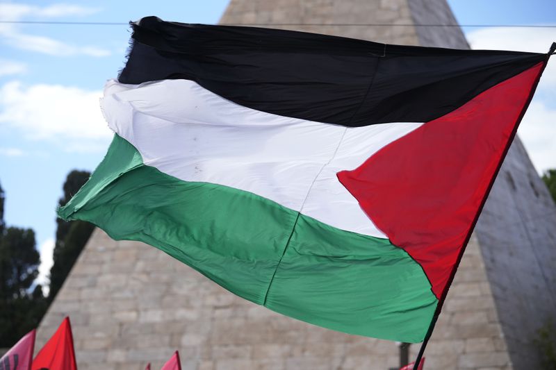 Palestinian flag is seen during a protest in Rome, Saturday, Oct. 5, 2024. Pro-palestinians people take to the street in an unauthorised march in the centre of Rome two days ahead of the first anniversary of the Oct. 7. (AP Photo/Andrew Medichini)