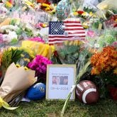 A memorial with images of the those killed are, from left, Richard "Ricky" Aspinwall, Cristina Irimie, Mason Schermerhorn and Christian Angulo at a memorial at Apalachee High School on Friday in Winder. (Jason Getz/The Atlanta Journal-Constitution)