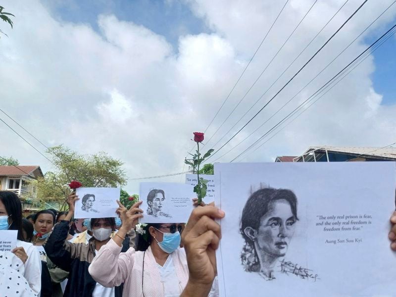 Demonstrators hold papers printed with Aung San Suu Kyi’s famous quote ''The only real prison is fear, and the only real freedom is freedom from fear'' as they rally to mark her 79th birthday in Launglon township in Tanintharyi region, Myanmar, Wednesday, June 19, 2024. (Democracy Movement Strike Committee-Dawei via AP)