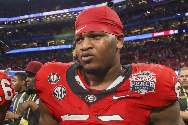 Georgia defensive lineman Jalen Carter (88) reacts after their win against Ohio State during the Peach Bowl Playoff Semifinal at Mercedes-Benz Stadium, Sat., Dec. 31, 2022, in Atlanta. Georgia won 42-41. (Jason Getz / Jason.Getz@ajc.com)