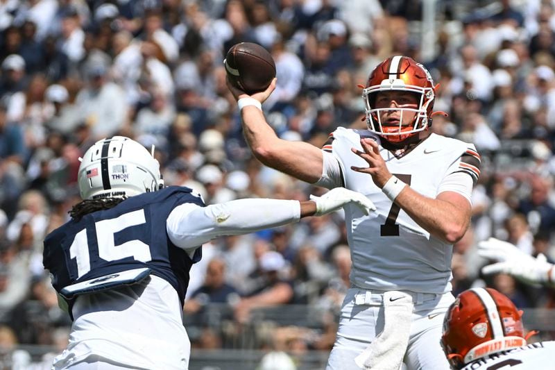 Bowling Green quarterback Connor Bazelak (7) throws a pass over Penn State defensive end Amin Vanover (15) during the first quarter of an NCAA college football game, Saturday, Sept. 7, 2024, in State College, Pa. (AP Photo/Barry Reeger)