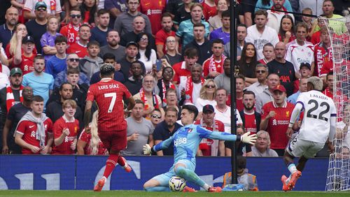 Liverpool's Luis Diaz scores his side's second goal of the game, during the English Premier League soccer match between Liverpool and Bournemouth, at Anfield, in Liverpool, England, Saturday, Sept. 21, 2024. (Peter Byrne/PA via AP)