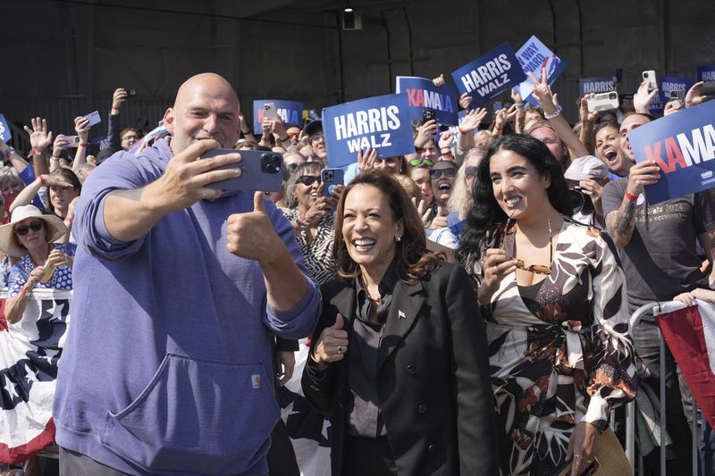 Democratic presidential nominee Vice President Kamala Harris takes a selfie with Sen. John Letterman, D-Pa., and his wife Gisele Barreto Fetterman, after Harris arrived at John Murtha Johnstown-Cambria Airport, in Johnstown, Pa., for a campaign event, Friday, Sept. 13, 2024. (AP Photo/Jacquelyn Martin)