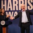 This image released by NBC shows Maya Rudolph as Kamala Harris, left, and Jim Gaffigan as Tim Walz, during the cold open sketch on "Saturday Night Live" in New York on Saturday, Sept. 28, 2024. (Will Heath/NBC via AP)