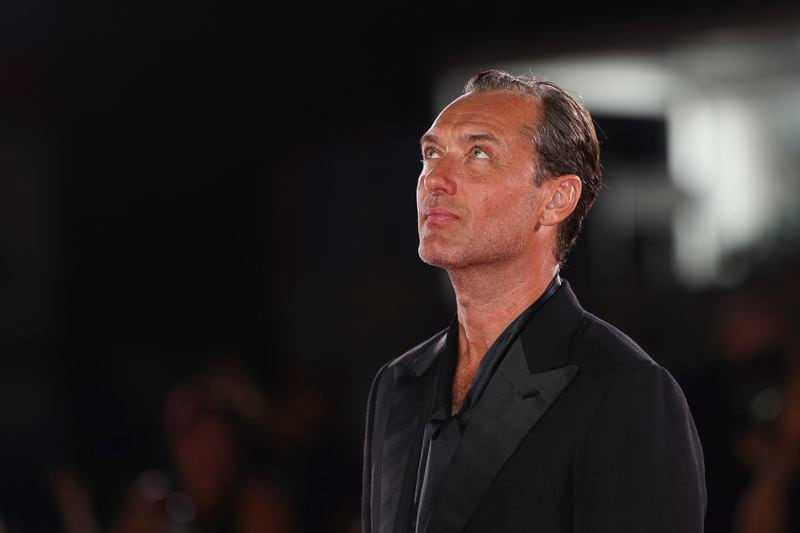 Jude Law poses for photographers upon arrival for the premiere of the film 'The Order' during the 81st edition of the Venice Film Festival in Venice, Italy, on Saturday, Aug. 31, 2024. (Photo by Vianney Le Caer/Invision/AP)