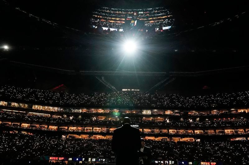 Actor Samuel L. Jackson speaks during an Atlanta Falcons Ring of Honor induction ceremony for Atlanta Falcons owner Arthur Blank at halftime of an NFL football game between the Atlanta Falcons and the Kansas City Chiefs, Sunday, Sept. 22, 2024, in Atlanta. (AP Photo/Brynn Anderson)