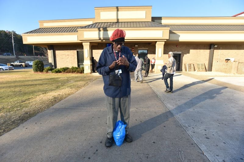 Byron Ferguson  waits for a ride outside Alatrade Foods in Phoenix City, Ala.