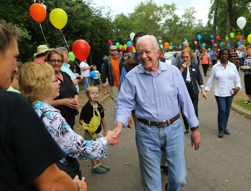 Former President Jimmy Carter shakes hands with the hometown folks arriving for his birthday party with former first lady Rosalynn Carter at Maxine Reese Park on Sunday, Sept. 28, 2014, in Plains.  CURTIS COMPTON / CCOMPTON@AJC.COM
