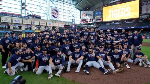 The Detroit Tigers pose for a team photo after their 5-2 win against the Houston Astros in Game 2 of an AL Wild Card Series baseball game Wednesday, Oct. 2, 2024, in Houston. (AP Photo/Kevin M. Cox)