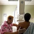 A woman gets her routine yearly mammogram at Mt. Sinai Hospital in Chicago.  (Heather Charles/Chicago Tribune/TNS)