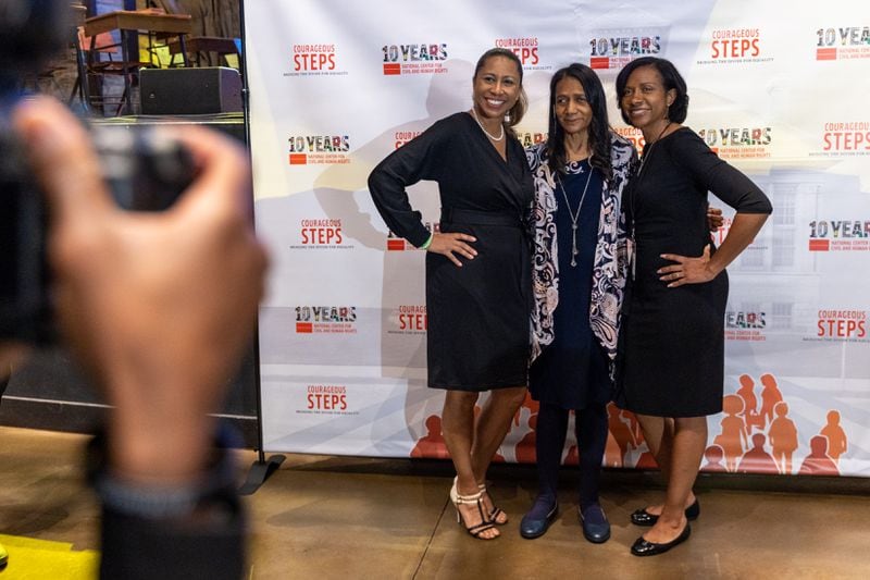 Linda Clonts (center) was one of 13 students who integrated McEachern High School in Powder Springs in 1965. She dropped out of school after taking several months of abuse there. Last month, Clonts — shown here with daughters Mia Oberlton and Keisha Lewis — was honored at the National Center for Civil and Human Rights' 2024 Power to Inspire Awards, celebrating those who desegregated schools. (Arvin Temkar / arvin.temkar@ajc.com)