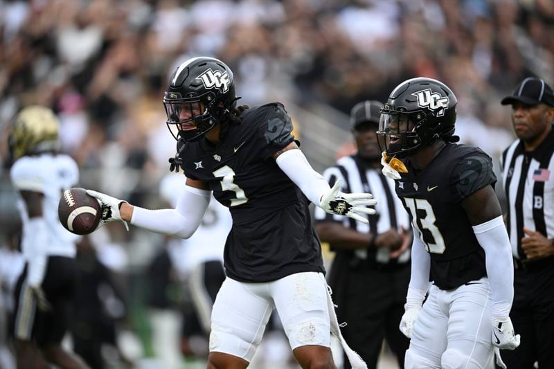 Central Florida linebacker Deshawn Pace (3) celebrates his interception as defensive back Ladarius Tennison (13) joins him during the first half of an NCAA college football game against Colorado, Saturday, Sept. 28, 2024, in Orlando, Fla. (AP Photo/Phelan M. Ebenhack)