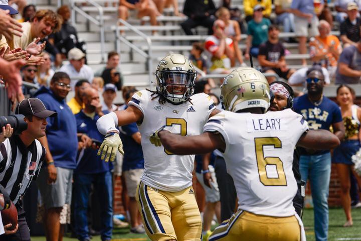 D.J. Moore celebrates his touchdown reception with Christian Leary during Georgia Tech's spring football game in Atlanta on Saturday, April 15, 2023.   (Bob Andres for the Atlanta Journal Constitution)