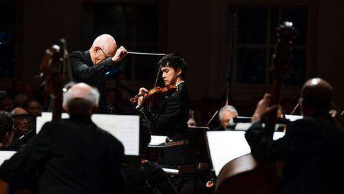 Guest conductor John Morrison leads the Johns Creek Symphony Orchestra with violinist Kevin Zhu. (Photos by Bret Baker)