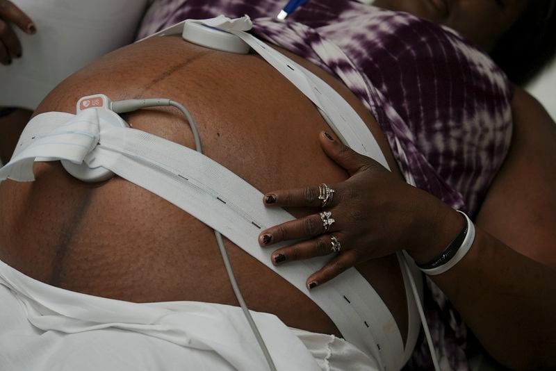 Denis Jones receives a nonstress test during a prenatal appointment at the Oklahoma State University obstetrics and gynecology clinic in Tulsa, Okla., on Tuesday, July 16, 2024. (AP Photo/Mary Conlon)