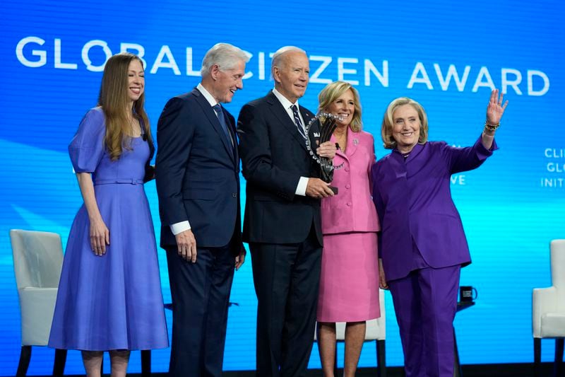 President Joe Biden is presented with the Global Citizen Award by Chelsea Clinton, former President Bill Clinton, first lady Jill Biden and former Secretary of State Hillary Clinton at the Clinton Global Initiative Monday, Sept. 23, 2024, in New York. (AP Photo/Manuel Balce Ceneta)