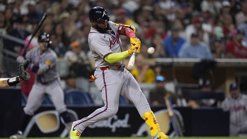 Atlanta Braves' Marcell Ozuna hits a home run during the ninth inning of a baseball game against the San Diego Padres, Friday, July 12, 2024, in San Diego. (AP Photo/Gregory Bull)