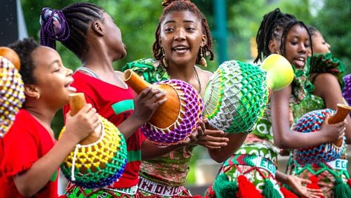 The performing arts collective Egun Omode performs at Centennial Olympic Park for the Juneteenth Atlanta Parade and Music Festival on Saturday, June 19, 2021. (Photo: Steve Schaefer for The Atlanta Journal-Constitution)