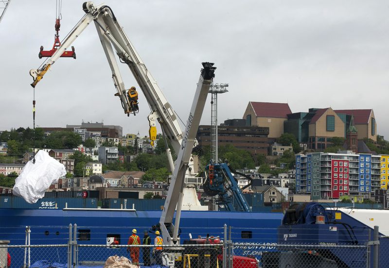 FILE - Debris from the Titan submersible, recovered from the ocean floor near the wreck of the Titanic, is unloaded from the ship Horizon Arctic at the Canadian Coast Guard pier in St. John's, Newfoundland, June 28, 2023. (Paul Daly/The Canadian Press via AP, File)