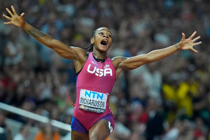FILE - Sha'Carri Richardson, of the United States, celebrates after winning the gold medal in the final of the Women's 100-meters during the World Athletics Championships in Budapest, Hungary, Aug. 21, 2023. There is one more item to scratch off the list before everyone from Richardson to Noah Lyles to Sydney McLaughlin-Levrone embark on their trips to Paris for the Olympics: Making the Olympic team. US track trials start Friday., June 21, 2024. (AP Photo/Petr David Josek, File)