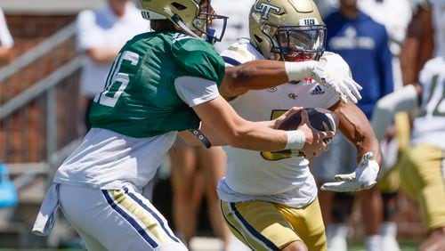 Georgia Tech quarterback Brody Rhodes (16) fakes the handoff to running back Anthony Carrie (6) during the White and Gold game at Bobby Dodd Stadium in Atlanta on Saturday, April 13, 2024. (Bob Andres for The Atlanta Journal-Constitution)