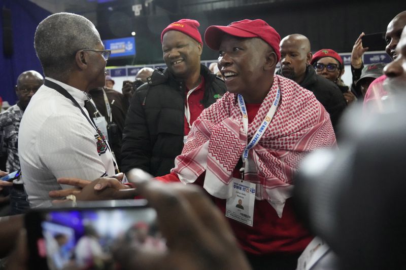 FILE - Economic Freedom Fighters (EFF) leader, Julius Malema, front center, arrives at the Results Operation Centre (ROC) in Midrand, Johannesburg, South Africa, Saturday, June 1, 2024. South African lawmakers are expected to elect the country's president on Friday, June 14 after being sworn in at the first sitting of Parliament that will also reveal the kind of unity government the ruling African National Congress has managed to cobble together after losing its majority for the first time since 1994. (AP Photo/Themba Hadebe, File)