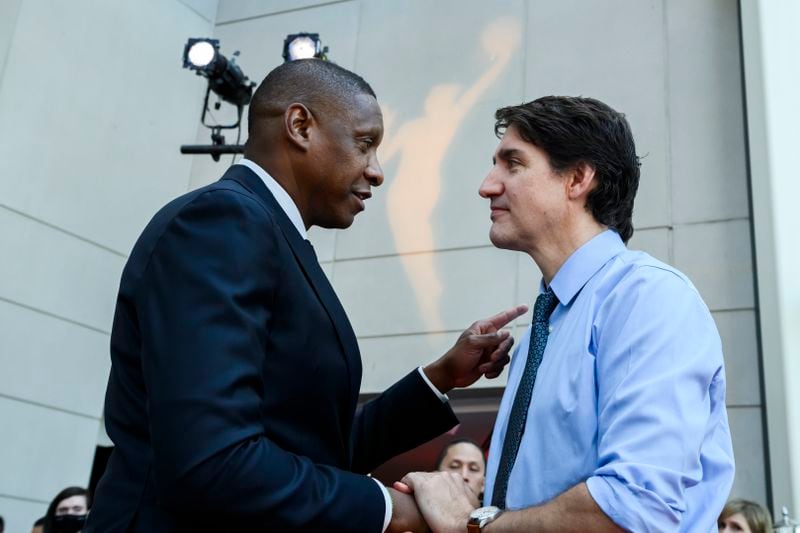 Toronto Raptors president Masai Ujiri and Canada's Prime Minister Justin Trudeau chat following a press conference announcing Toronto's WNBA franchise, in Toronto on Thursday, May 23, 2024. (Christopher Katsarov/The Canadian Press via AP)