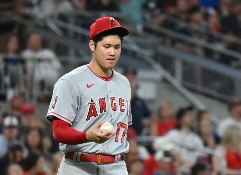 Angels' starting pitcher Shohei Ohtani (17) reacts after allowing an RBI single by Atlanta Braves' right fielder Eddie Rosario in the 7th inning. (Hyosub Shin / Hyosub.Shin@ajc.com)