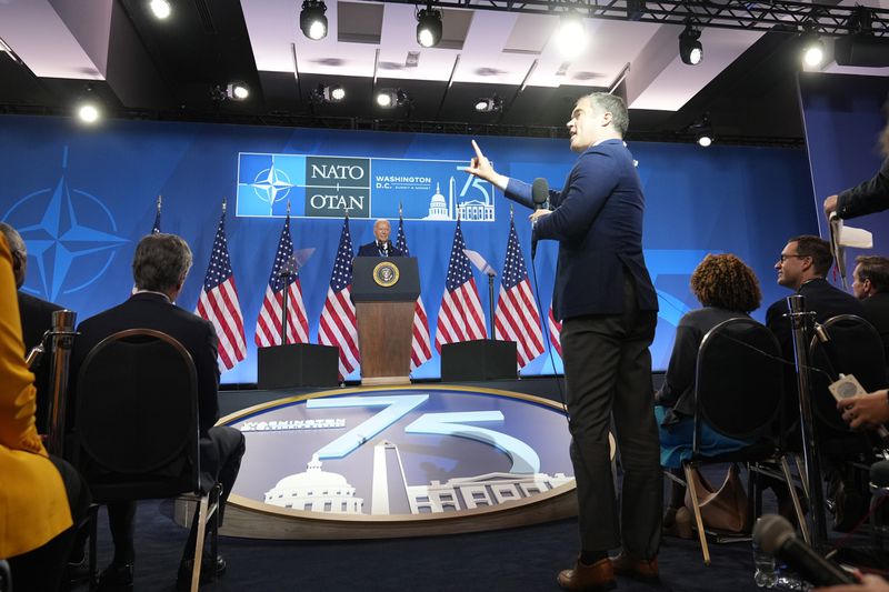 A reporter stands to ask a question at the conclusion of a news conference with President Joe Biden following the NATO Summit in Washington, Thursday, July 11, 2024. (AP Photo/Susan Walsh)