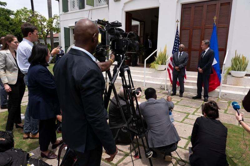 U.S. Secretary of State Antony Blinken, right, and Haitian Transitional Presidential Council Coordinator Edgard Leblanc Fils speak to the press at the U.S. Chief of Mission Residence in Port-au-Prince, Haiti, Thursday, Sept. 5, 2024. (Roberto Schmidt/Pool photo via AP)