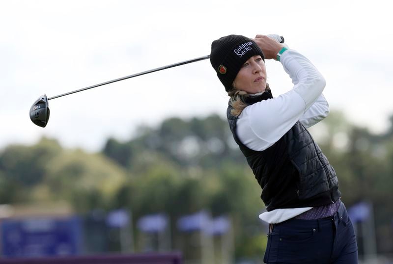 United States' Nelly Korda plays her tee shot on the 4th during the third round of the Women's British Open golf championship, in St Andrews, Scotland Saturday, Aug. 24, 2024. (AP Photo/Scott Heppell)