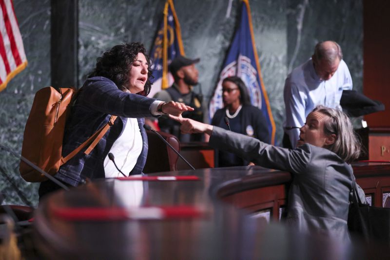 Atlanta City Council member Liliana Bakhtiari reacts as a protestor comes into the chambers after the council members voted 11 to 4 to approve legislation to fund the training center, on Tuesday, June 6, 2023. Bakhtiari voted against the funding. (Jason Getz/The Atlanta Journal-Constitution)