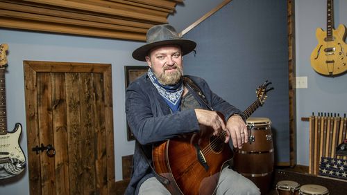 02/04/2021 —Sandy Springs, Georgia —  Musician John Driskell Hopkins sits for a portrait at his studio in Sandy Springs, Thursday, February 4, 2021. (Alyssa Pointer / Alyssa.Pointer@ajc.com)