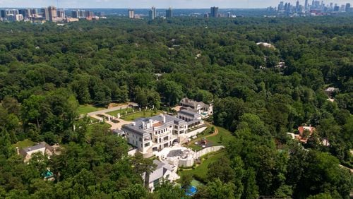 An aerial photo shows a Buckhead neighborhood and the Atlanta skyline. (Hyosub Shin / Hyosub.Shin@ajc.com)