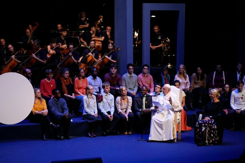 Pope Francis delivers his message as he meets with students in the Aula Magna of the Leuvain Catholic University, Saturday, Sept. 28, 2024. (AP Photo/Andrew Medichini)